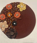 Brown felt beret decorated with mixed fabric flowers and pearl beads