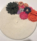 Cream felt beret with multicolor floral embellishments