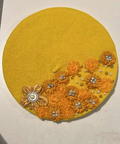 Mustard yellow felt beret decorated with golden orange fabric flowers, rhinestones and pearl beads