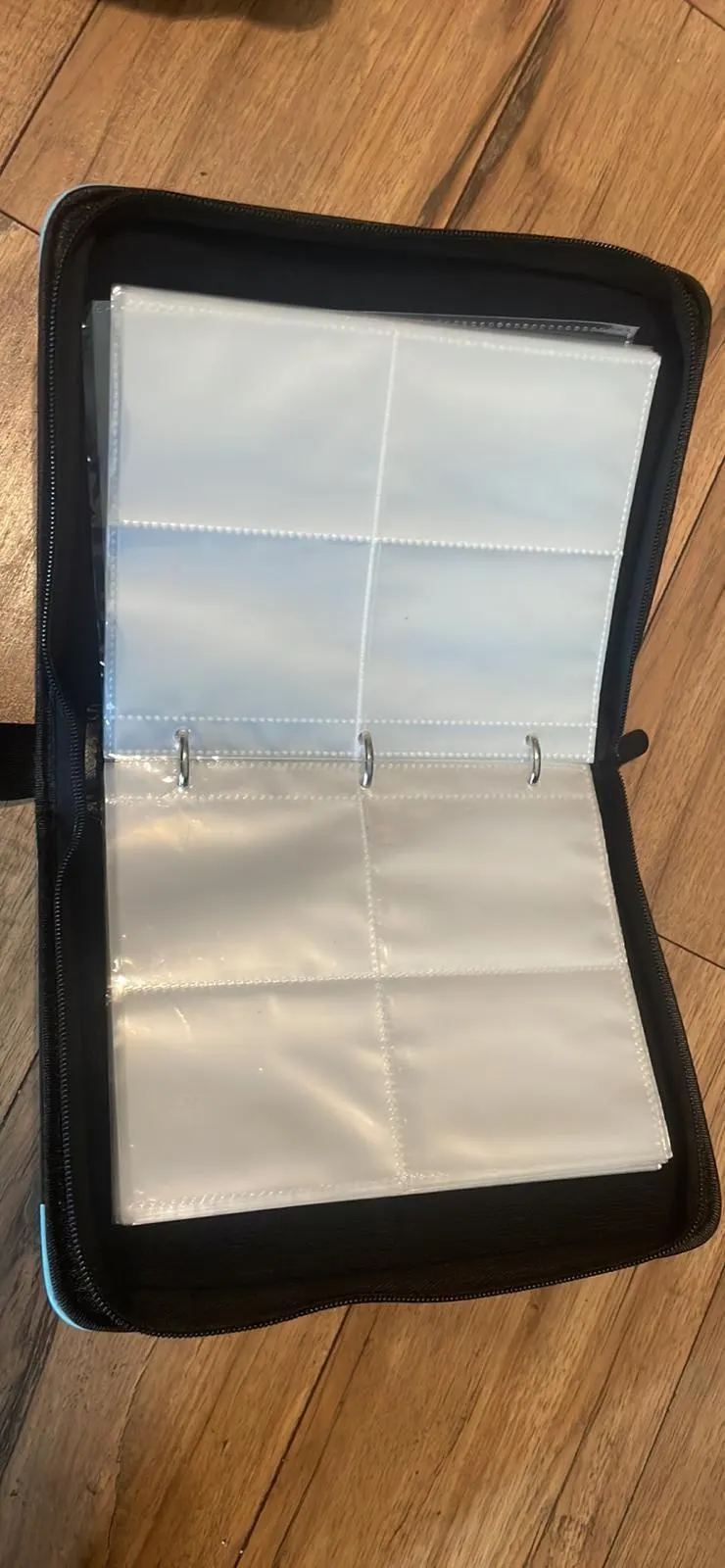 Pokémon 4-ring binder open showing clear card sleeves