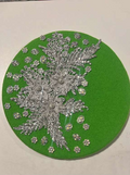 Bright green felt beret with silver lace floral appliqué and scattered rhinestone flower charms