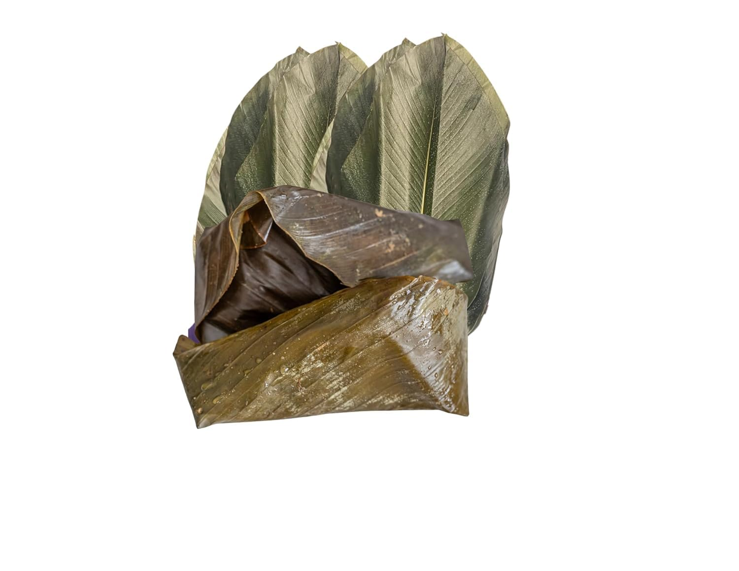 Moin Moin wrapped in banana leaves