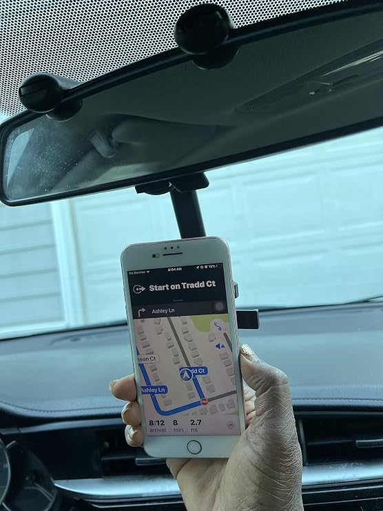 360 rotatable car phone holder mounted on rearview mirror showing navigation app in use